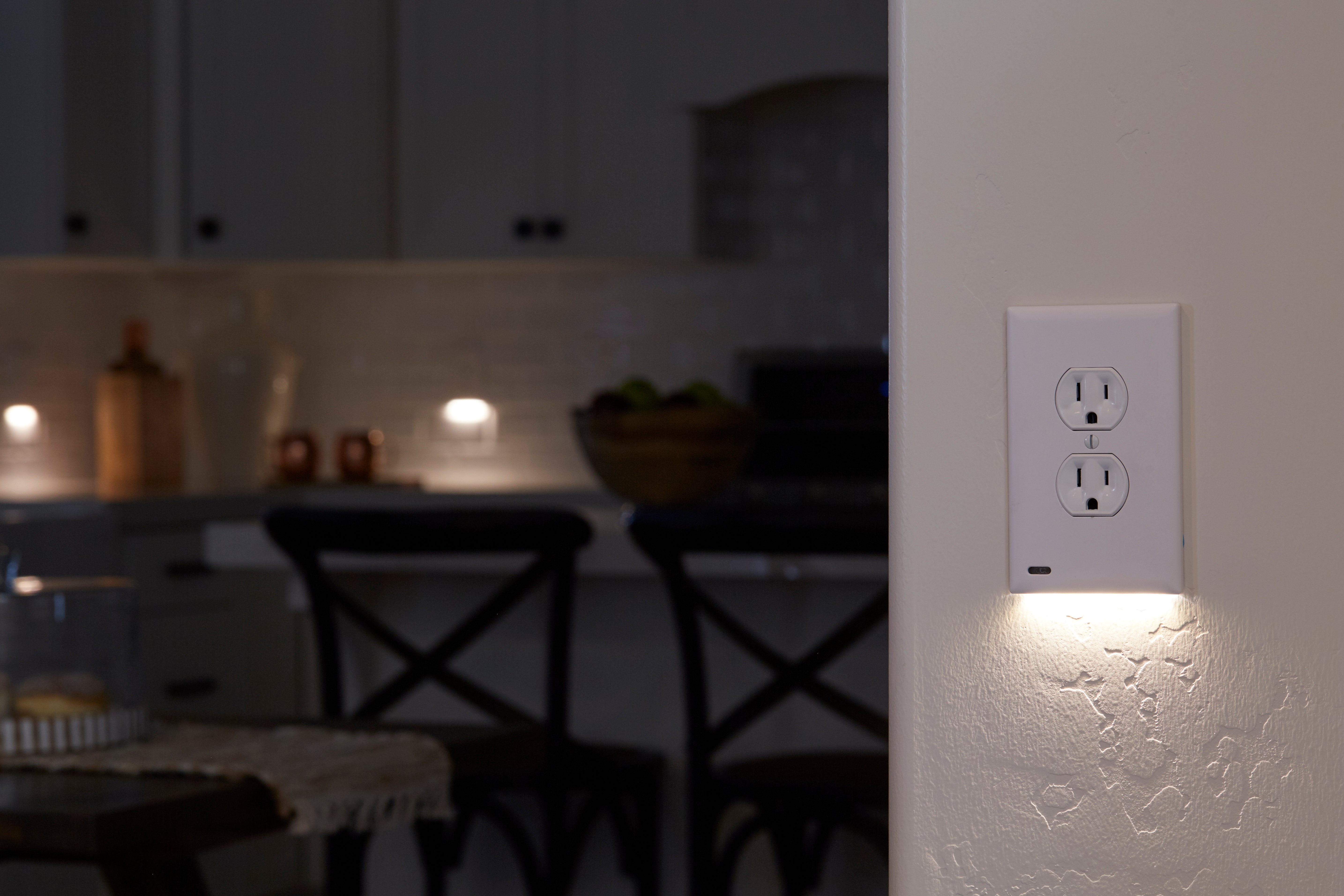 GuideLight PLUS glowing on a kitchen wall at night